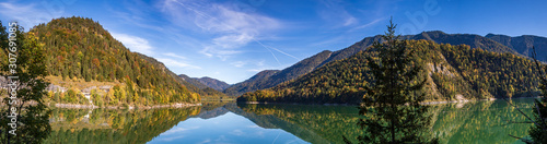 High resolution stitched panorama of a beautiful alpine view with reflections at the famous Sylvenstein lake, Bavaria, Germany