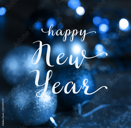 happy New Year  greeting card . Christmas blue background with bokeh, lights and Christmas balls. defocus. blurred focus. square format