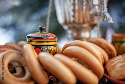 Quadro su tela Handmade utensils on the background of bagels and samovar