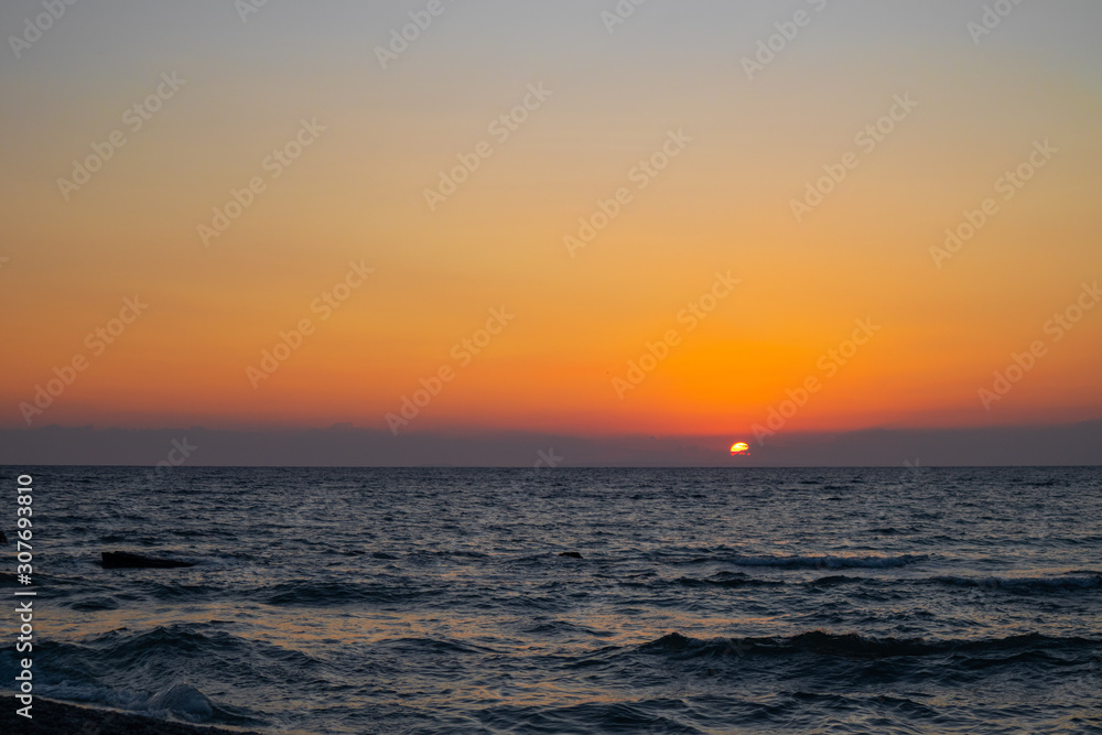 orange red sunrise at the beach