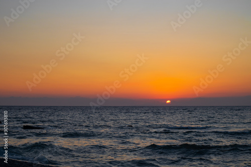 orange red sunrise at the beach © KyriaKos Kinatidis