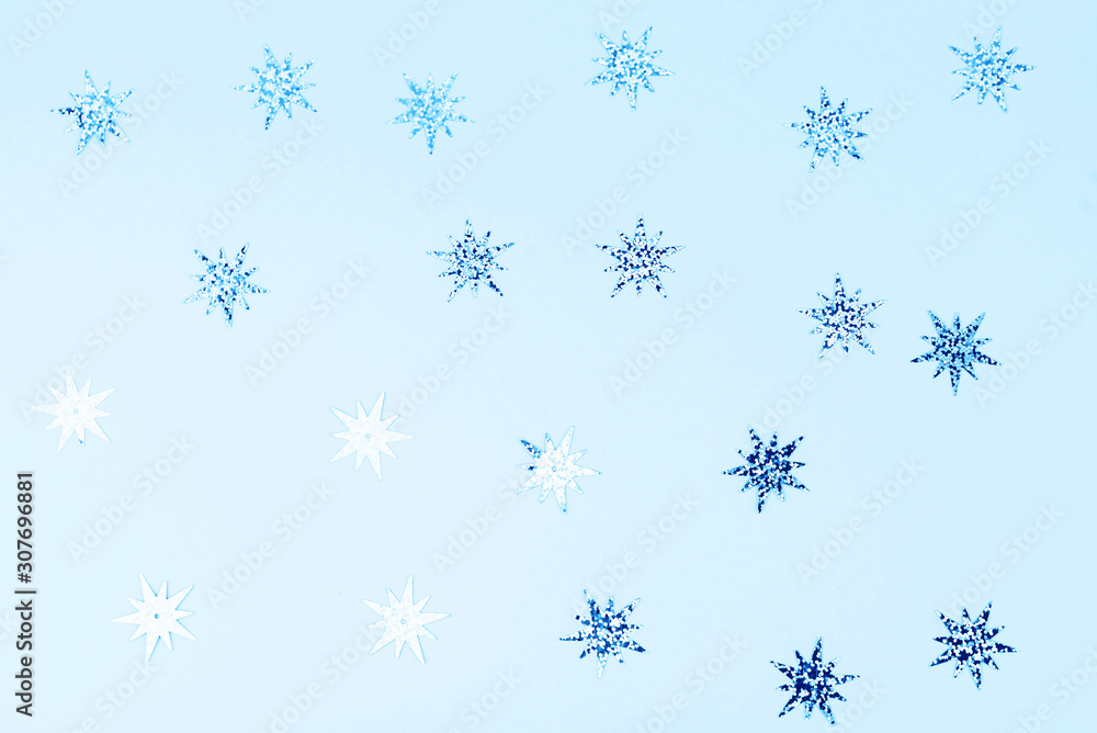 Festive and shiny background. Little stars on a light blue background. Festive and shiny background. Little stars on a light blue background.