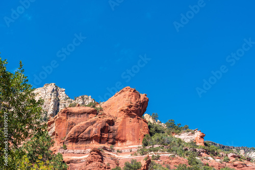 Low angle landscape of red and white rock formations at Slide Rock State Park in Sedona Arizona
