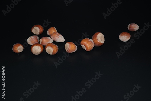 hazelnuts on black background photo