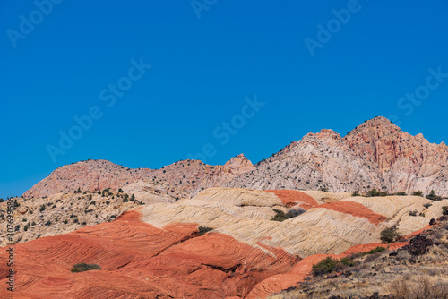 Landscape of orange and white stone hills at Snow Canyon State Park in Utah