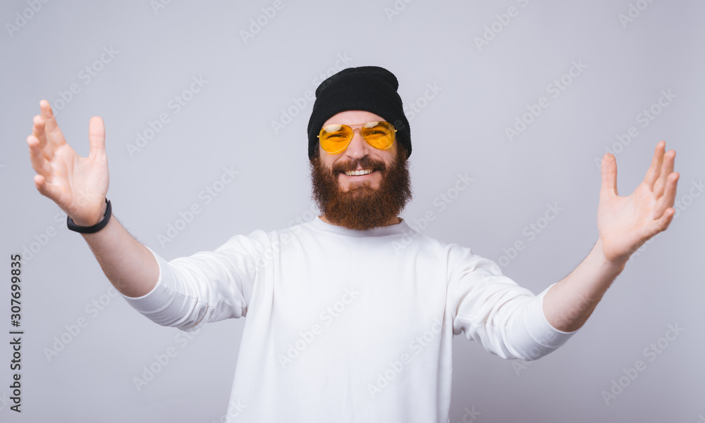 Naklejka premium Photo of happy young bearded man want to hug someone