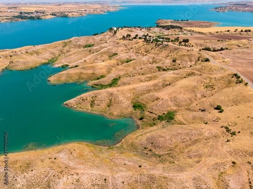Aerial view of rural and agricultural areas south of Lokman in the province of Adiyaman, Turkey. Inlets on the Euphrates river formed by the Ataturk dam. Desert lands