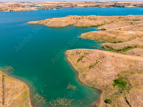 Aerial view of rural and agricultural areas south of Lokman in the province of Adiyaman, Turkey. Inlets on the Euphrates river formed by the Ataturk dam. Desert lands