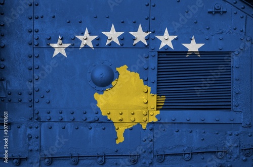 Kosovo flag depicted on side part of military armored tank closeup. Army forces conceptual background photo