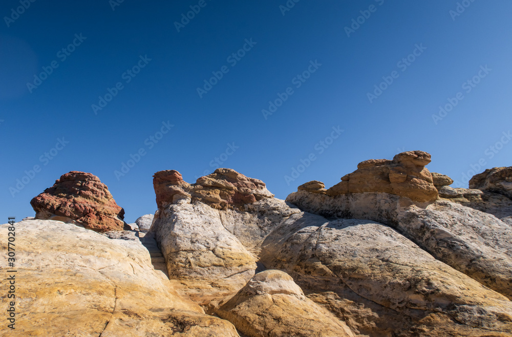 White and yellow rock formations and sky at El Morro National Monument in New Mexico