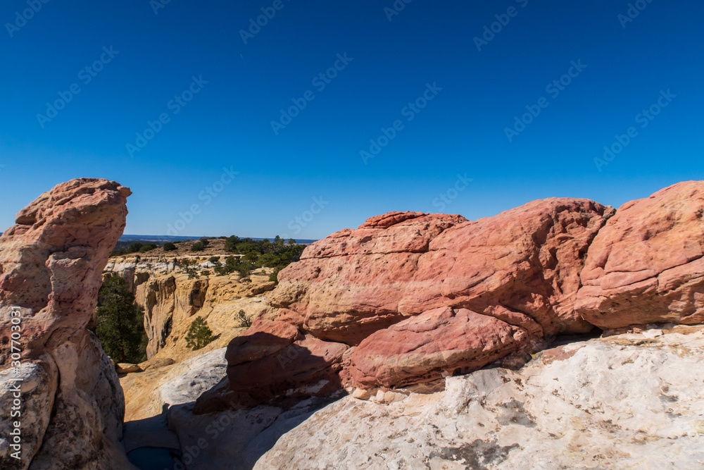 Landscape of multi-colored large rock formations atop El Morro National Monument in New Mexico