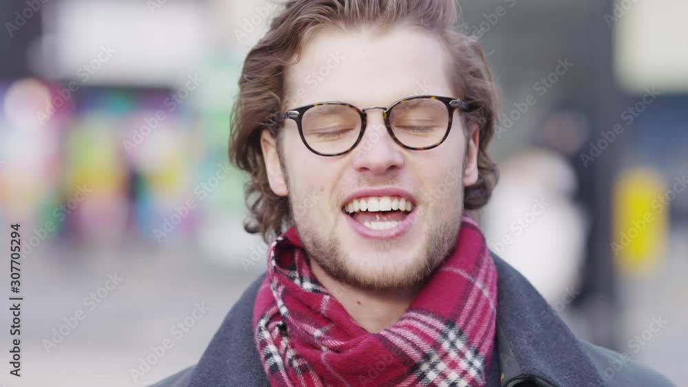 Portrait of attractive male talking expressively to camera in the city Portrait of attractive male talking expressively to camera in the city