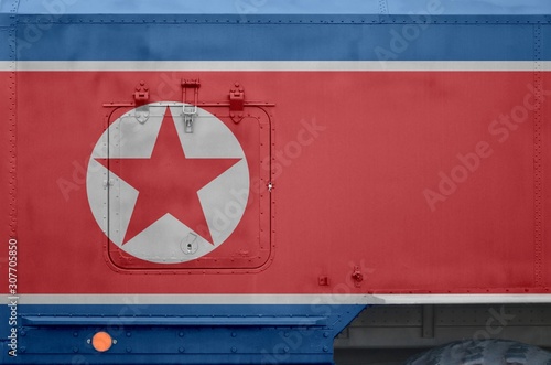 North Korea flag depicted on side part of military armored truck closeup. Army forces conceptual background photo