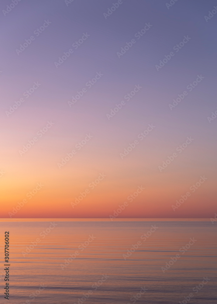 Vertical background of beuatiful sunset in the sea