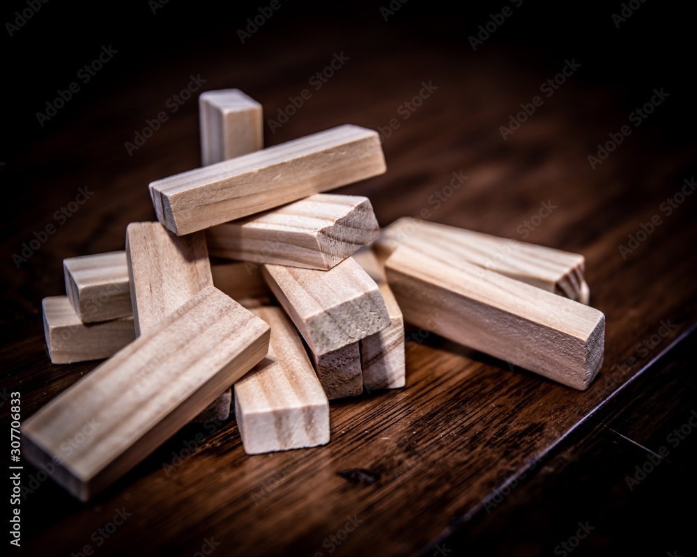 pile of wood puzzle pieces on wood floor