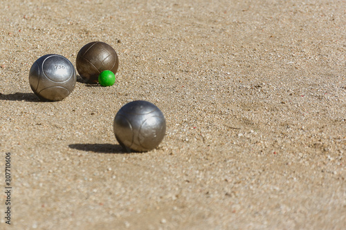 bocce balls on the floor of the game court