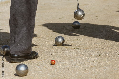 Bocce balls on the floor of the game court