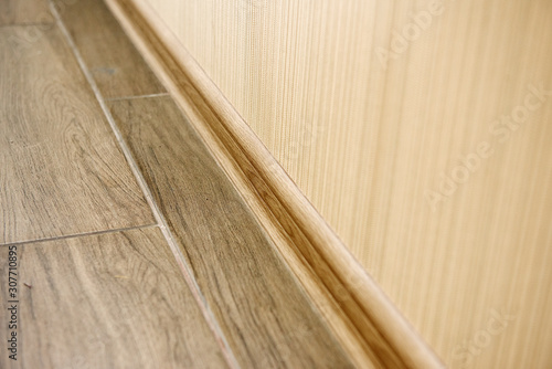 Close-up element of the flooring in beige color.