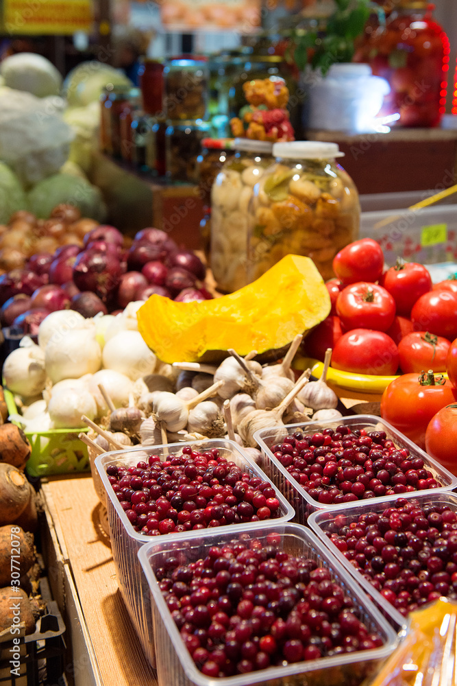 Vegetables and berries on the counter in the store. Vegetables and berries on the counter in the store.