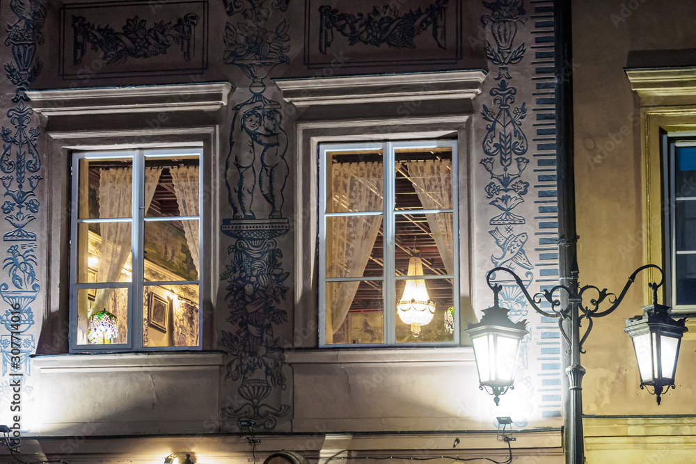 Night windows in the old city of Warsaw, Poland