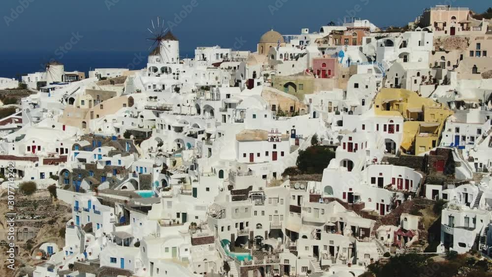 Flying Over Famous Blue Domed Church In Oia On Santorini Island In Greece Flying Over Famous Blue Domed Church In Oia On Santorini Island In Greece