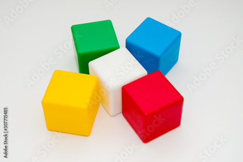 Children's colorful cubes on a white background, children's toys, educational games.