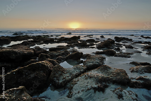 The rocky coast of Laguna Beach at sunset.