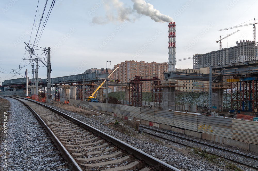 Fototapeta premium Reconstruction of Reutovo station of Moscow Railway with the construction of the IV main track, overpasses and the II track to Balashikha, Reutov, Moscow region, Russian Federation