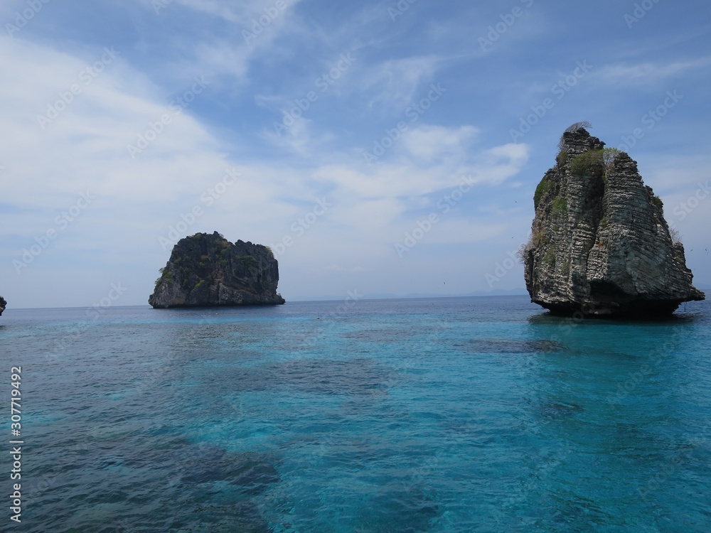 rocky islands towering towards the sky in thailand