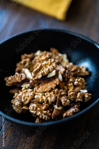 Walnut Kernels and Whole walnuts in Porcelain Bowl. © Alp Aksoy