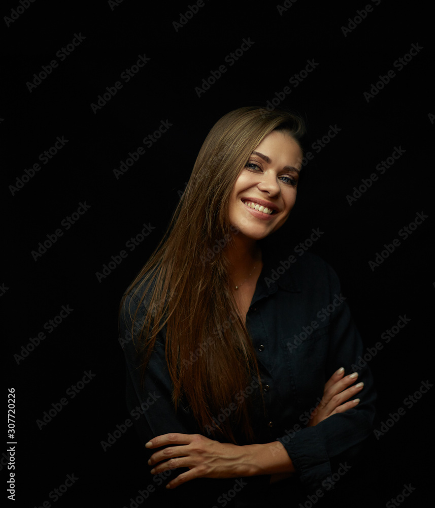 Happy smiling woman isolated on black.