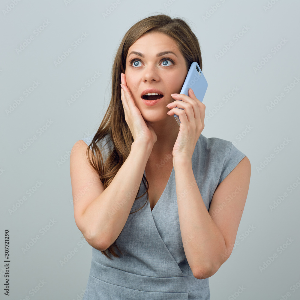 surprising young woman talking with phone. surprising young woman talking with phone.