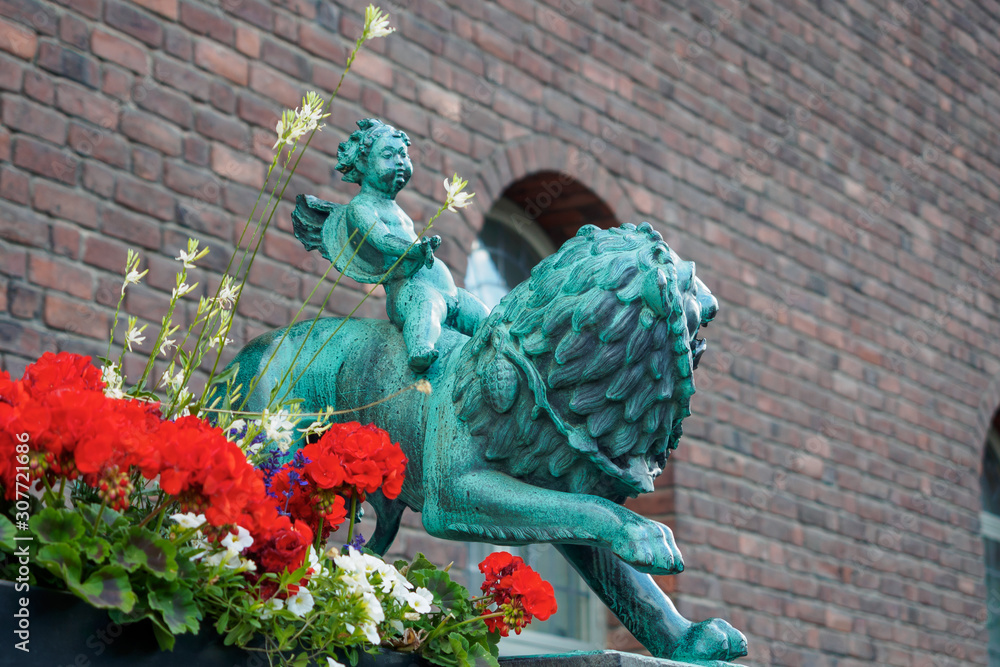 Statue of a lion and a boy near town hall, Stockholm, Sweden