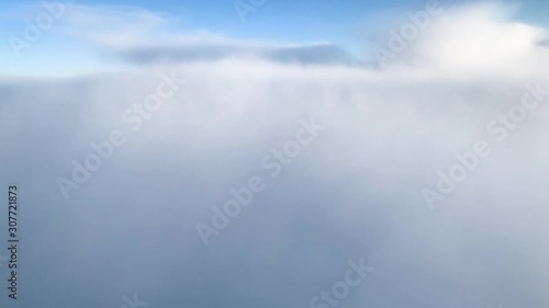 Wallpaper Mural aerial view of white clouds and blue sky from airplane window in cabin Torontodigital.ca