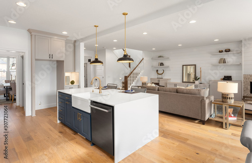 Beautiful kitchen and living room in new home with open concept floorplan