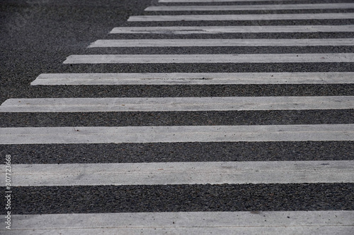 Crosswalk on the road for safety of people.