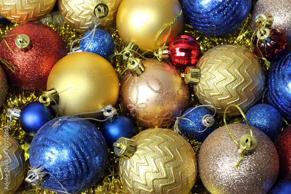 Colored Christmas toys in a box. Texture, background Colored Christmas toys in a box. Texture, background