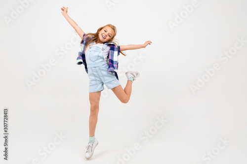 happy pretty european girl jumping on a white background
