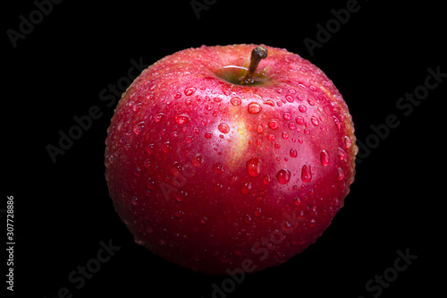 red apple on black background