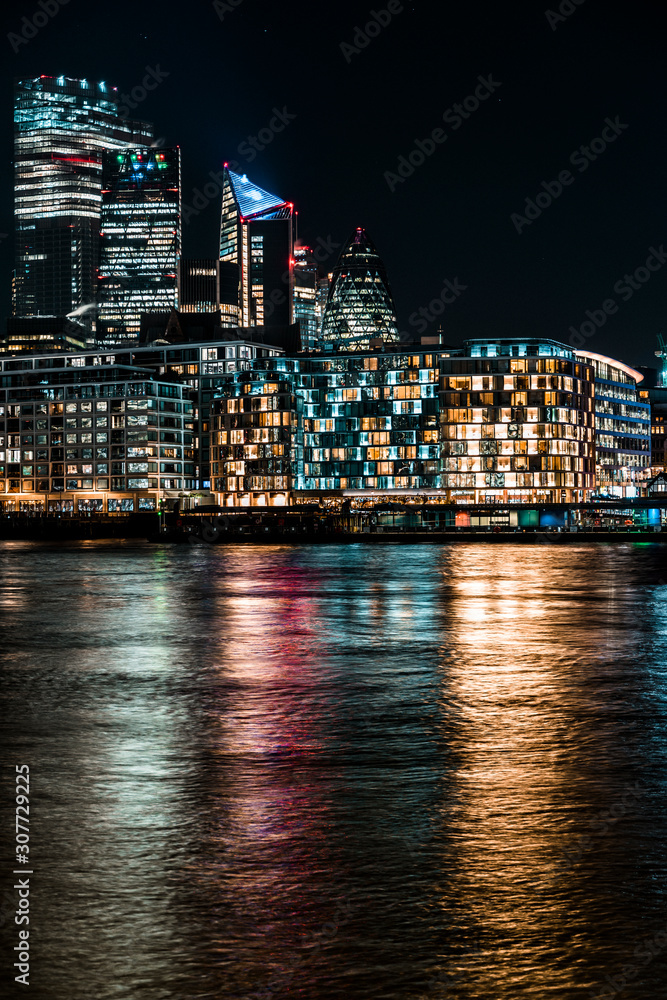 Londons modern skyline at night over looking the river Thames