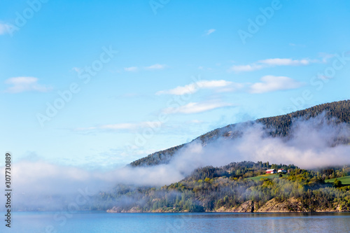 Scenery of smoke coming out of the mountains in Notodden, Telemark, Norway photo