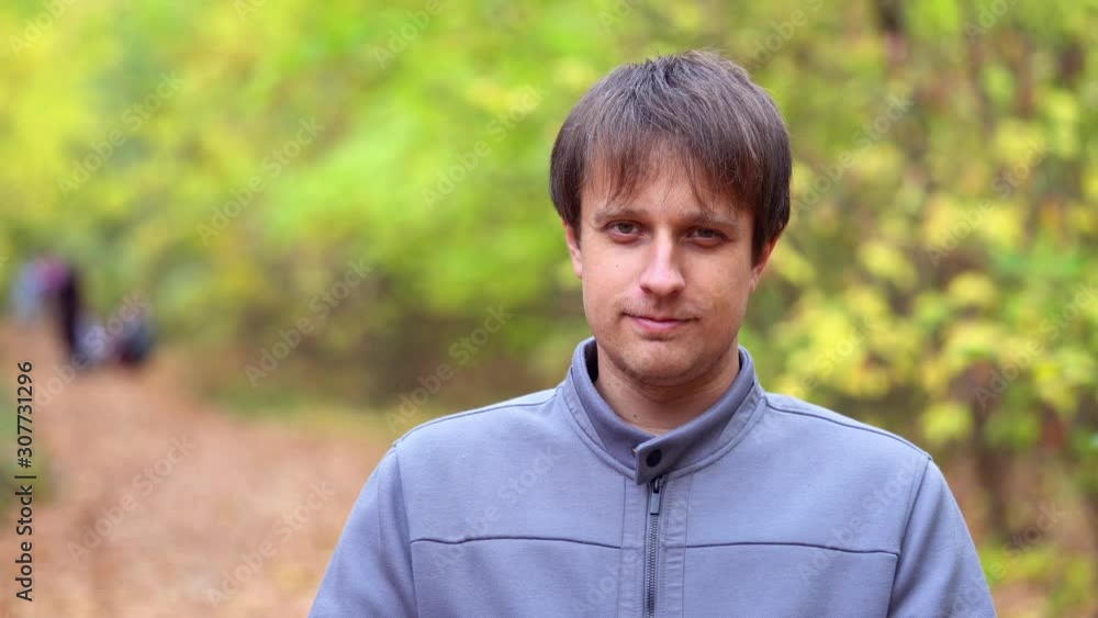 Portrait of young courageous man in autumn forest Portrait of young courageous man in autumn forest