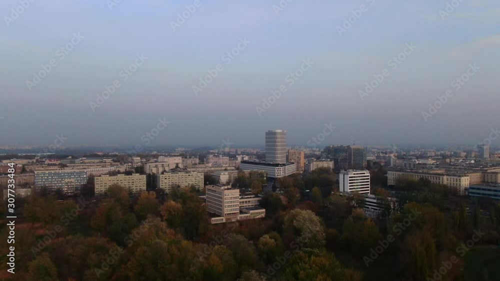 Drone aerial view of Warsaw city capitol of Poland with flying bird in from of the camera. Drone aerial view of Warsaw city capitol of Poland with flying bird in from of the camera.
