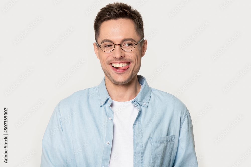 Funny laughing stylish man in glasses posing at photo studio Funny laughing stylish man in glasses posing at photo studio