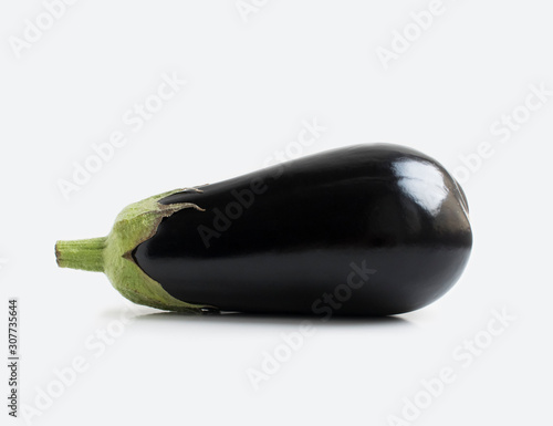Aubergine isolated on grey background. Eggplant close up photo.