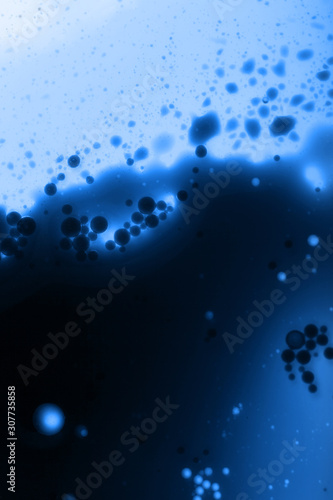 abstract background with streaks and spots in blue, place for text