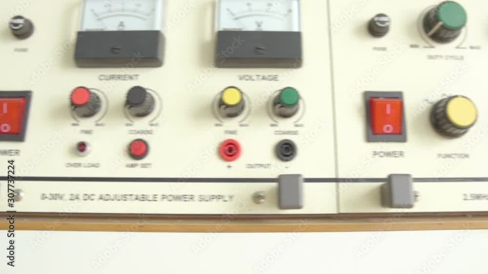 slow motion dolly shot of function generator in electric lab and stop at red emergency button control interface, safety laboratory concept slow motion dolly shot of function generator in electric lab and stop at red emergency button control interface, safety laboratory concept