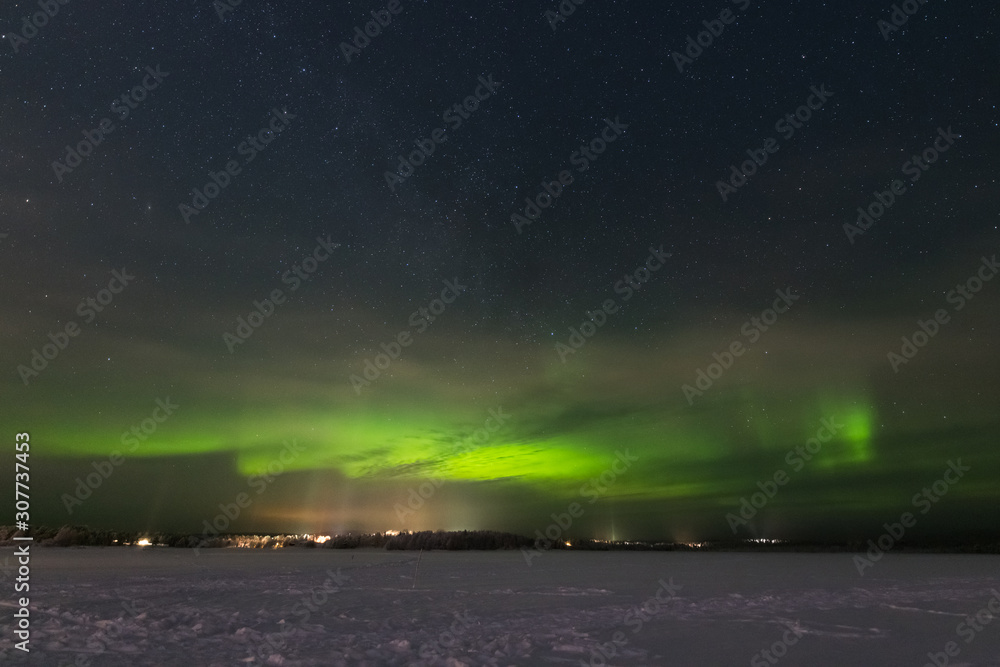 Aurora borealis and starry sky over Lapland
