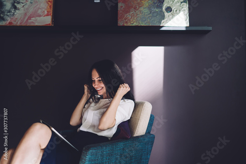 Quadro su tela Delighted woman with excitement looking at tablet