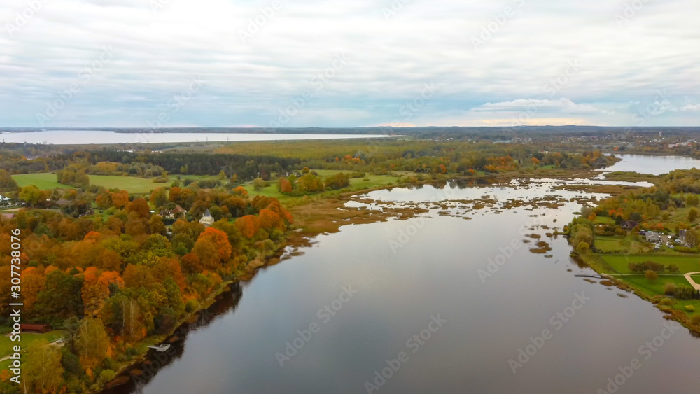 Doles Sala is the Second Largest Island in Latvia. This is a Peninsula in the Daugava River, Near the Borders of Riga. Aerial Dron Shoot. Sunny Autumn Day. Doles Sala is the Second Largest Island in Latvia. This is a Peninsula in the Daugava River, Near the Borders of Riga. Aerial Dron Shoot. Sunny Autumn Day.
